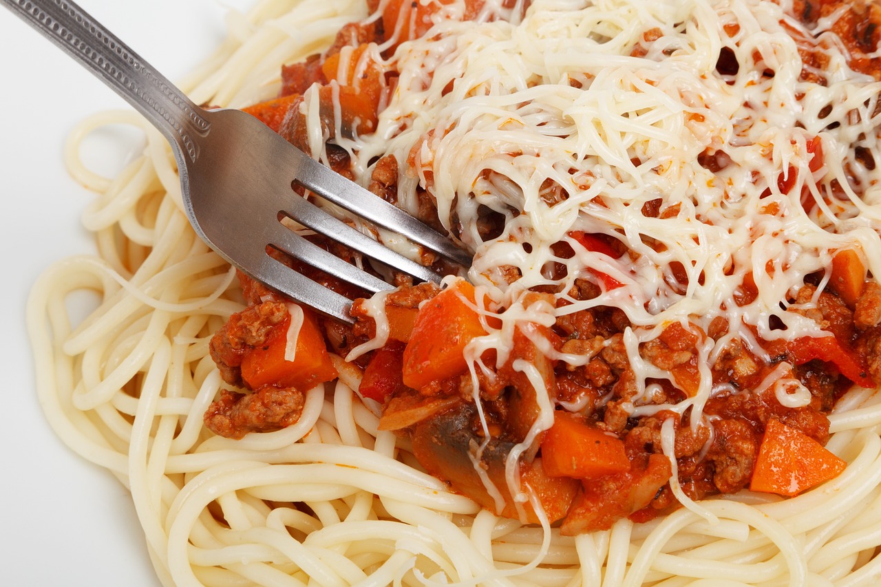 bolognese with cheese and spaghetti and fork - uni lunch ideas