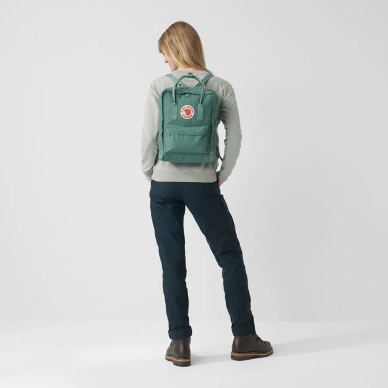 Screenshot 2021-09-30 at 10.31.42.png green backpack on woman - gifts for uni students