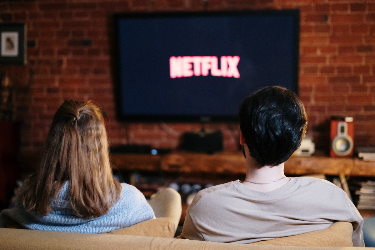 Couple watching Netflix on their TV