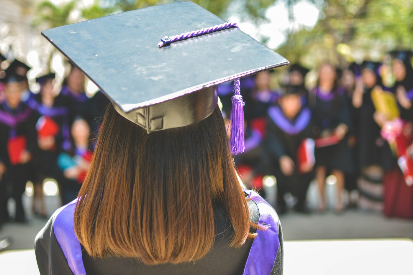 Graduation cap on woman. free masters degree online