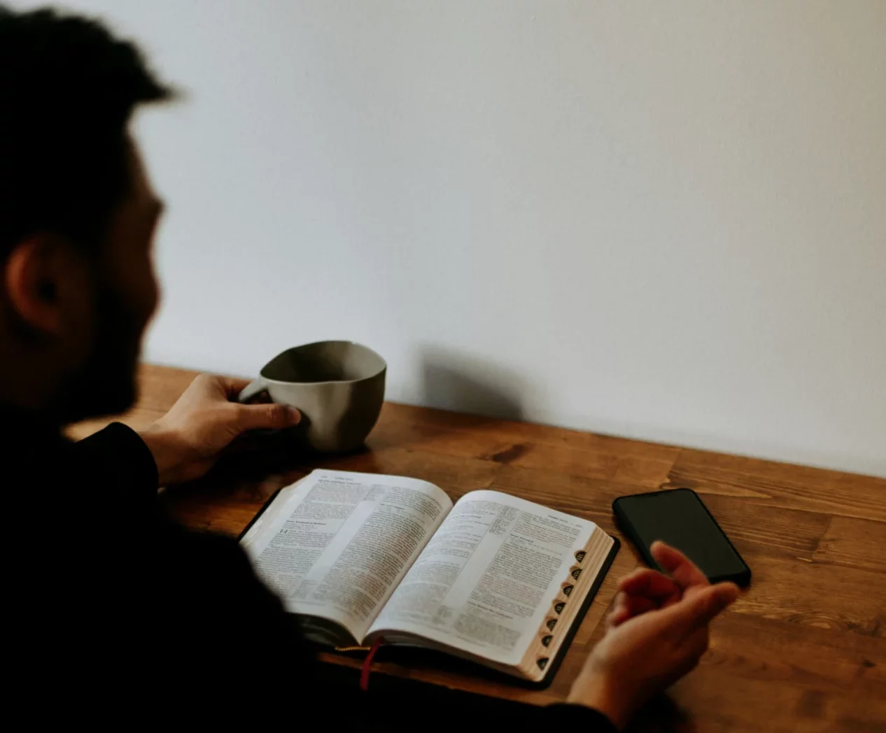 Student reading textbook during studies