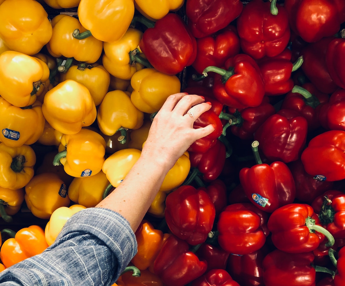 person picking out peppers