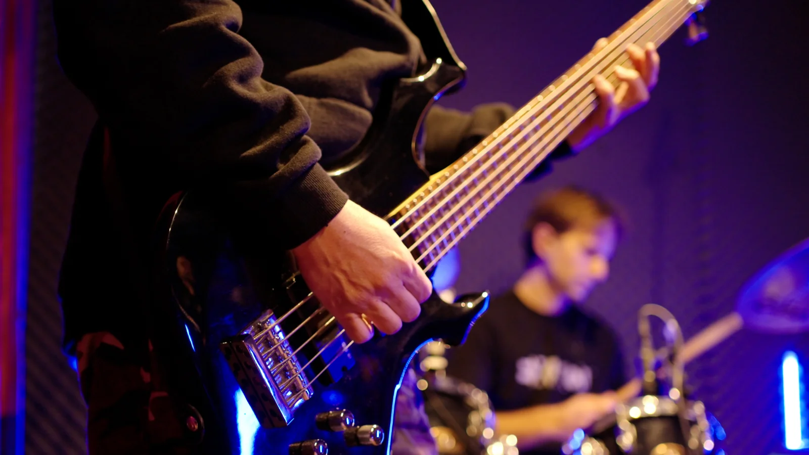 man playing guitar at a live event